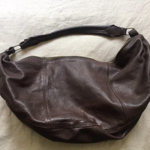 Large, burgundy leather sling handbag